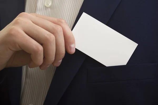 Hand holding white business card on white background. — Stock Photo, Image