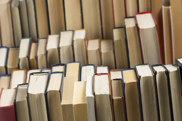 Stack of books background. many books piles. — Stock Photo, Image