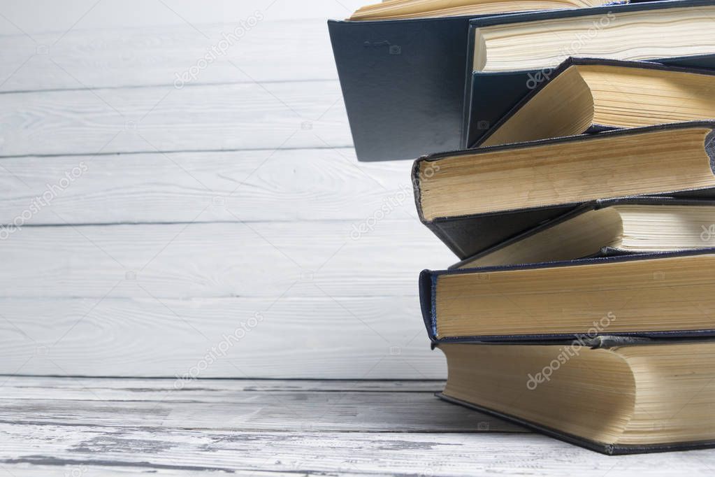 Stack of books background. many books piles.