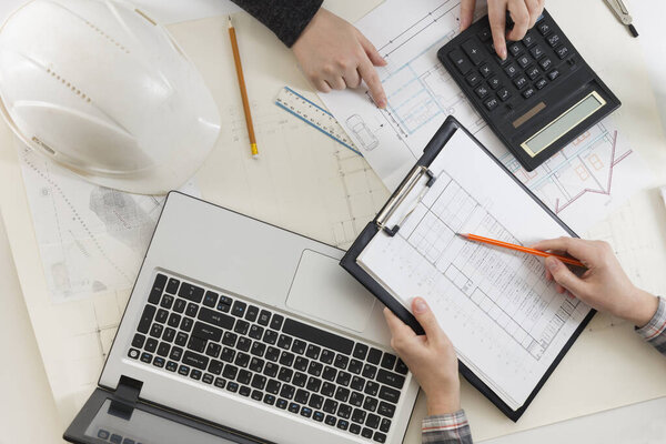 Architects working on blueprint, real estate project. Architect workplace. Construction concept. Engineering tools.