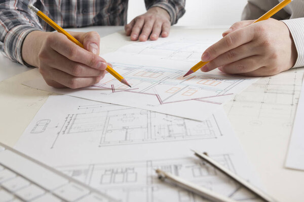 Architects working on blueprint, real estate project. Architect workplace. Construction concept. Engineering tools.
