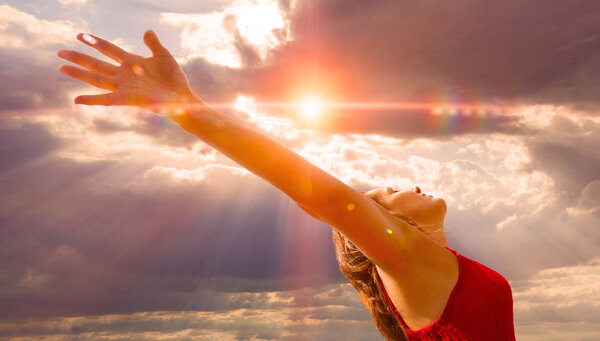 Freedom and wellness concept .Woman with open arms  ans sunset landscape