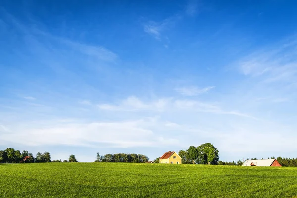 Yellow Farmhouse Rural Green Field Summer Blue Sky Green Grass Royalty Free Stock Photos