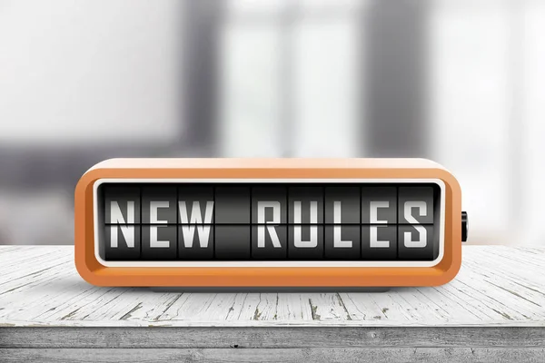 New rules alarm message on a wooden desk