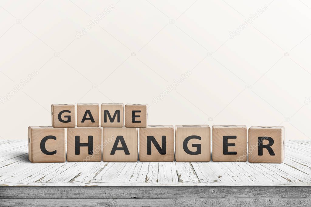 Game changer sign made of wooden blocks