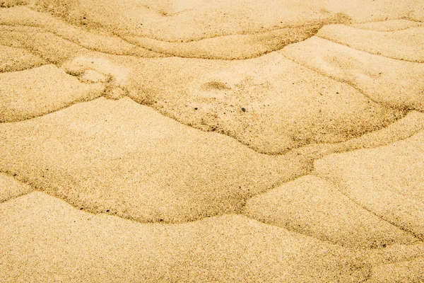 Zand Van Een Strand Met Golfpatronen — Stockfoto