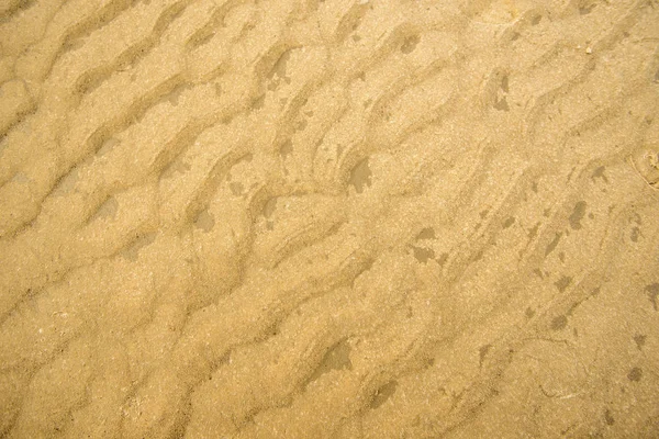 Areia de uma praia com padrões — Fotografia de Stock