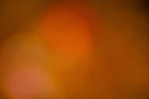 Background of blurred red color with circles