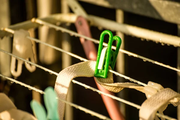 Drying rack on a balcony with raindrops — Stock Photo, Image