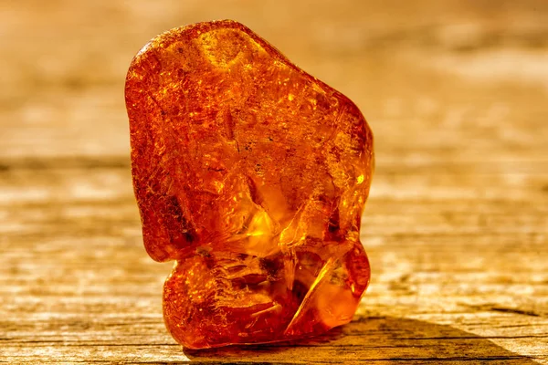 Amber in sun with inclusions — Stock Photo, Image