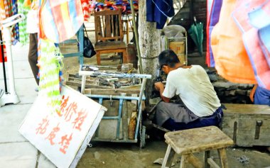 Eski Çin 'de bir sokakta zanaatkâr.