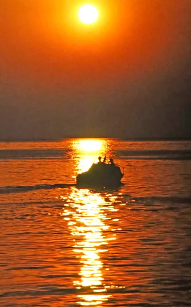 sunset over the Mediterranean Sea with boat