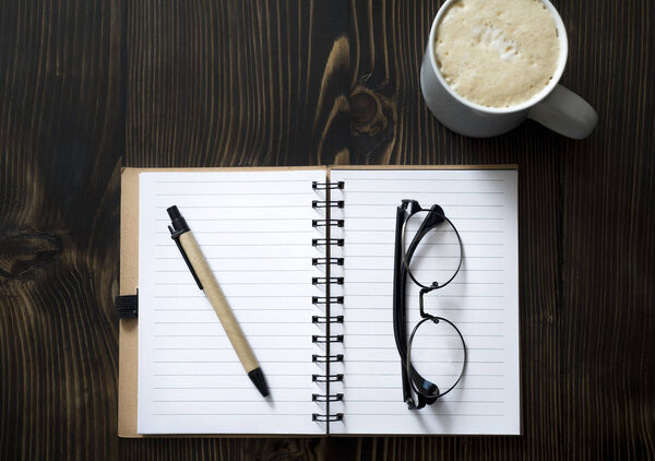 Blank Notebook and  Coffee  on a Desk,  from above