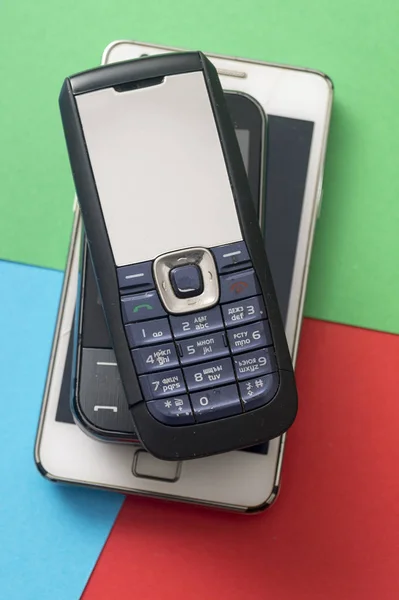 Old and obsolete cellphone on a RGB background. — Stock Photo, Image