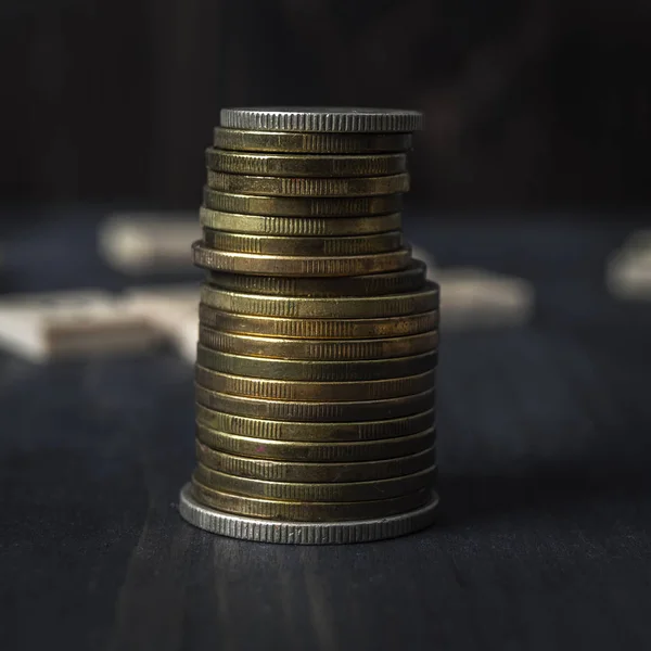 Stucks of coins on the wooden table — Stock Photo, Image