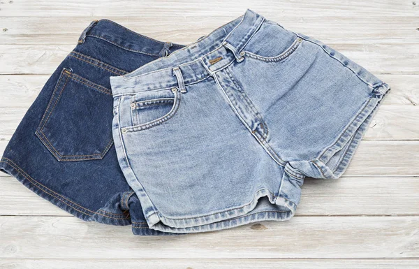 Two Vintage Woman Jeans Denim Shorts Wooden Shelf Shorts New — Stock Photo, Image