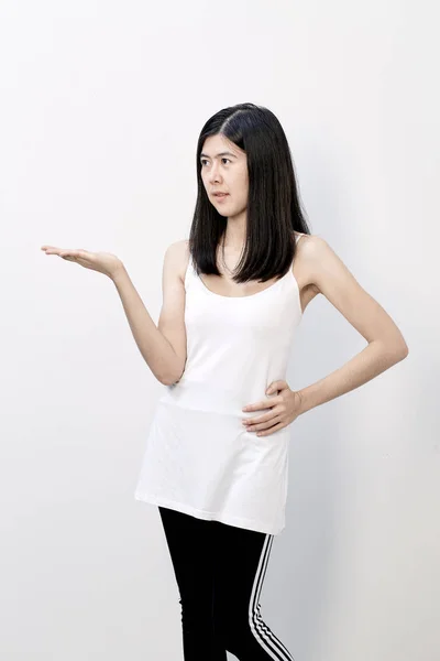 Smiling Slender Asian Woman Presenting Copyspace Palms White Background — Stock Photo, Image