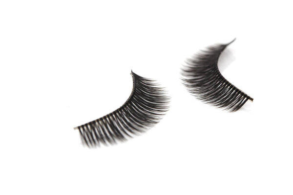 Closeup composition false Eyelashes style for woman eyes on white background with copy space