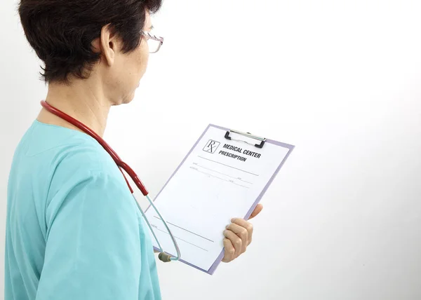 Backside Medical Professional Holding Clipboard Stethoscope White Background — Stock Photo, Image