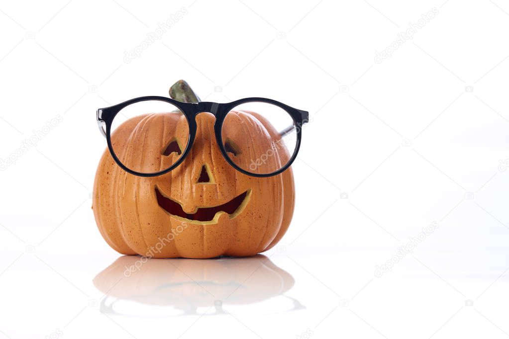 Carved smiling pumpkin Jack-o'-lantern with spectacle