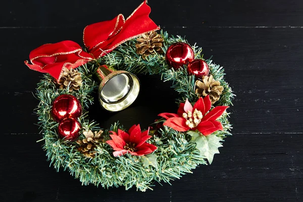 Wreath Red Ribbon Christmas on black wooden