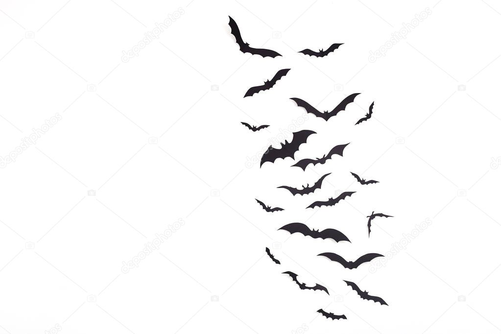 Halloween and decoration Empty space for design copy pace - black paper bats flying over white background