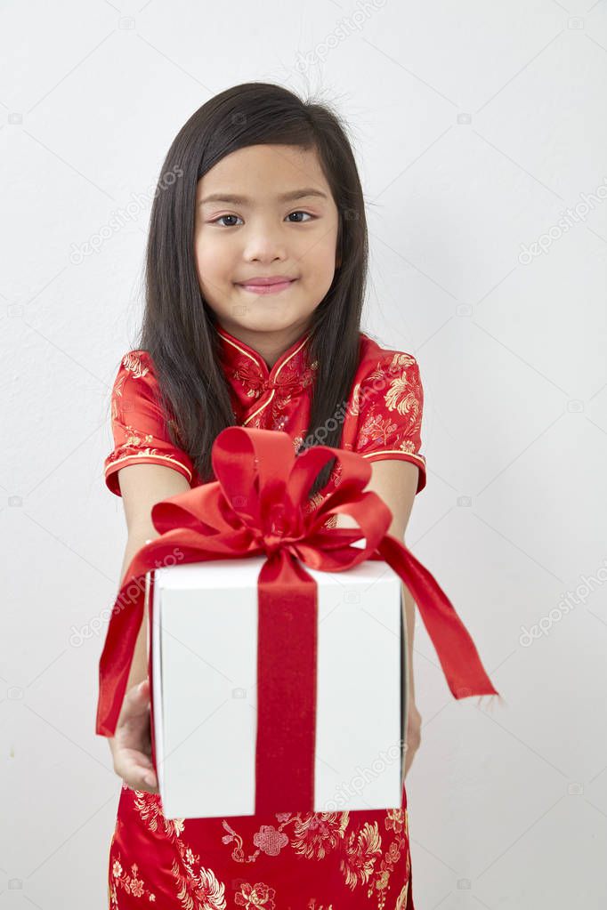 Chinese Girl eight year old girl with Chinese New Year 2019 With gift box on white backgrond, Concept New Year Sale