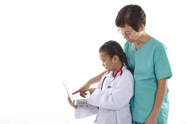 Old Woman Girl Doctor Costumes Chatting While Holding Laptop Isolated — Stock Photo, Image