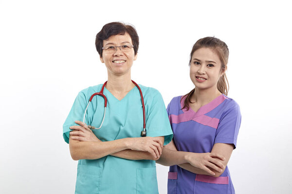 Two Medical person Nurse  young doctor portrait Confident young woman medical professional isolated on white background Young pretty multiracial Asian Caucasian female model
