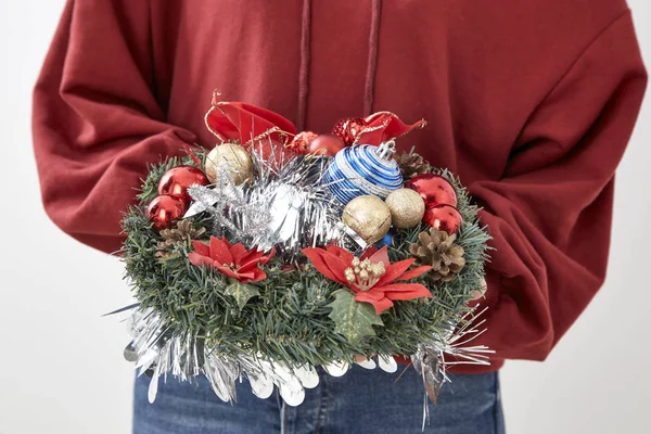 Asian  beauty young woman with christmas wreath and gift on white wall  background