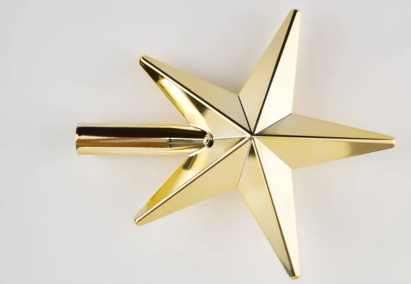 Golden Christmas Star on white Background. Top View Close-Up Gold Star render