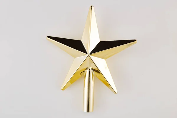 Golden Christmas Star on white Background. Top View Close-Up Gold Star render