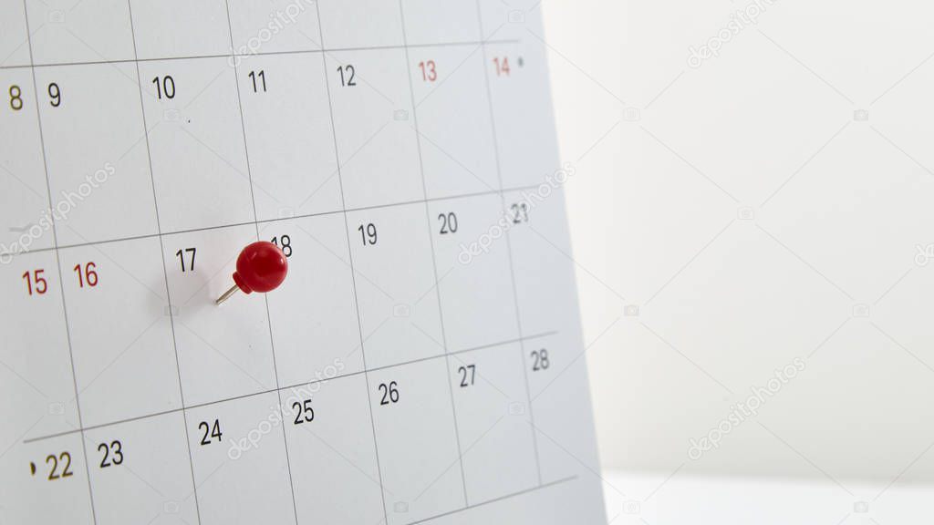 Red thumbtack a date 17th on calendar or planner. Tax Day 2018 takes place on April 17. selective focus