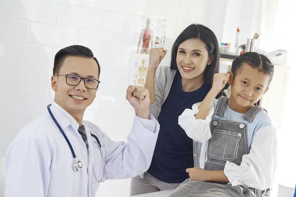 Doctor with medical clinic background for nursing care professional and patient trust in hospital\'s hospitality concept, Mother and Asian daughter come to the doctor.