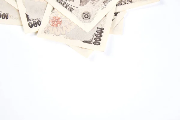 Japanese yen banknotes and Japanese yen coin on white background