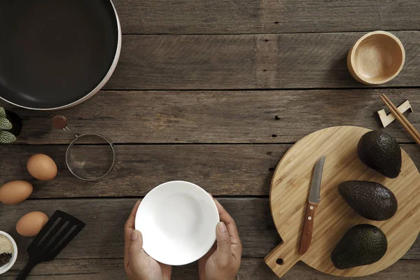 Avocado Hawaii food poke bowl Composition of kitchen devices on wooden table, Healthy Food Concepts, free copy space, flat lay food