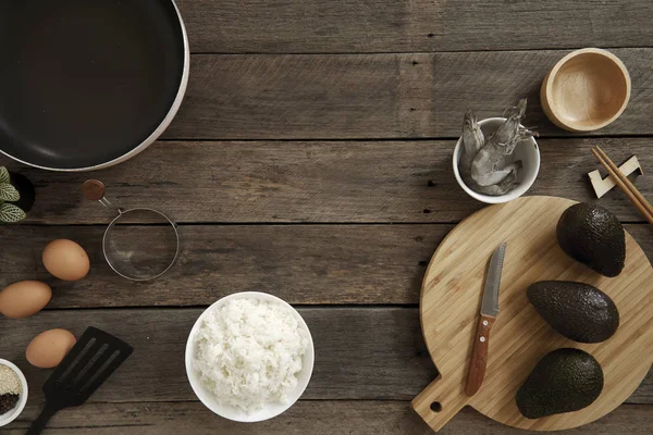 Avocado Hawaii food poke bowl Composition of kitchen devices on wooden table, Healthy Food Concepts, free copy space, flat lay food