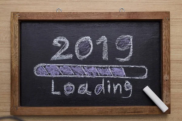 2019 loading with progress bar, chalk drawing on blackboard