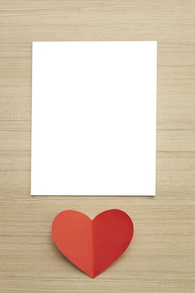 Valentine\'s day red paper heart on abstract wooden background with for text love and young happy joyful, paper cut red heart, love Invitation card