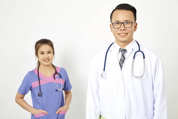 Doctor with nurse working in a medical clinic. Two hospital workers discussing on laboratory test. on white background