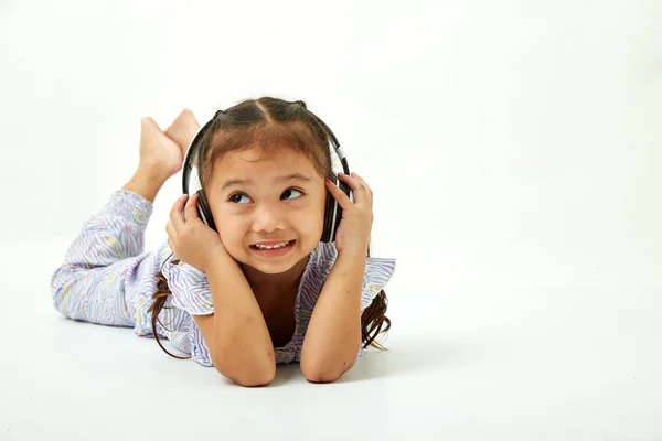 Asian Little Girl Headphones Listening Music Looking Copy Space Area — Stock Photo, Image