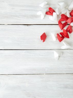 White and red flying hearts bright love passion frame border white wooden background. confetti love signs holiday. for Valentines Day decoration, empty space for text
