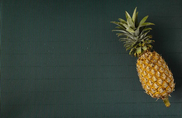 Pineapple on paper green background — Stock Photo, Image