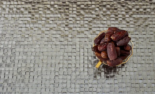 Palm Dates on silver floor — Stock Photo, Image