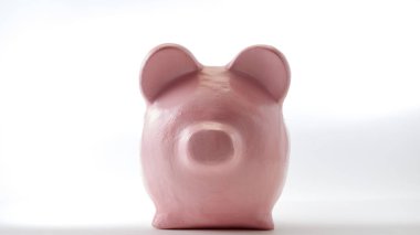 beyaz zemin üzerinde pembe kumbara