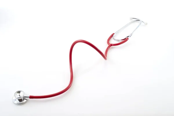 Červený stetoskop na pozadí — Stock fotografie