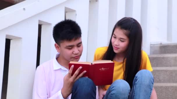 Students Friends Sitting Stairs Using Book — Stock Video