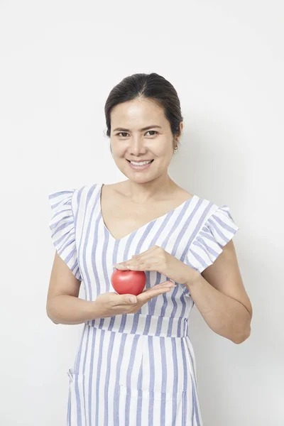 Woman holding red heart shaped — Stock Photo, Image