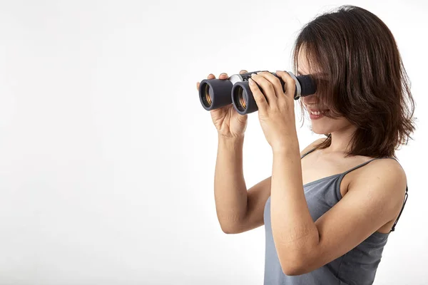 Young Asian woman with binoculars — Stock Photo, Image