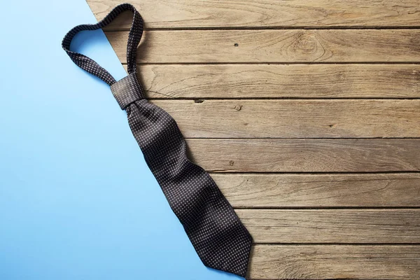 Fathers day tie on wooden desk backround